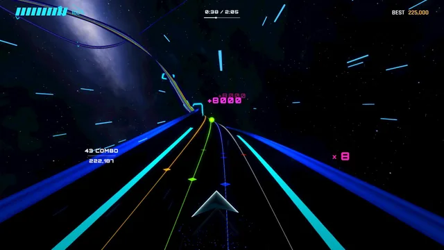 The track bends past a galaxy, with a score popup over the road.